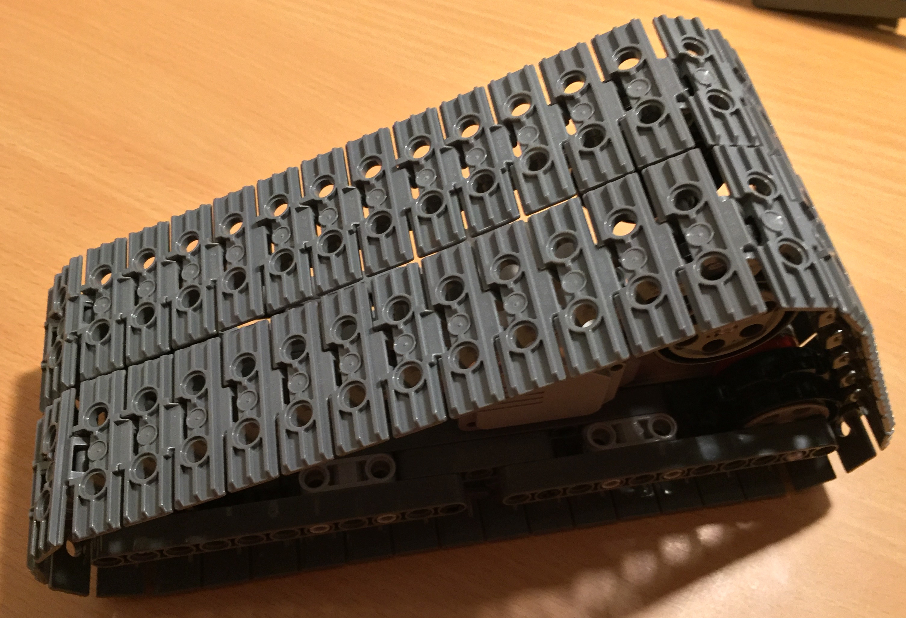 Triangular tracked wheel